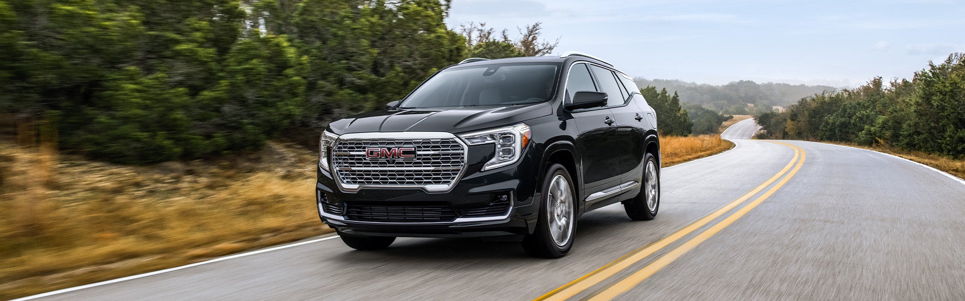 2024 GMC Terrain driving on an open road